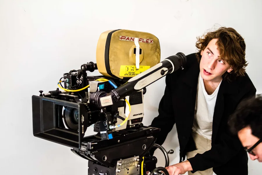 Cinema camera and crew member on a professional production